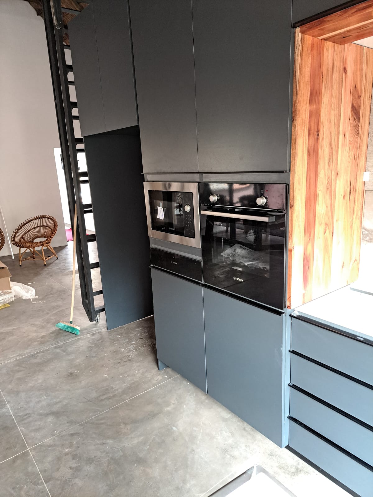 Matte dark grey kitchen with built-in Bosch ovens