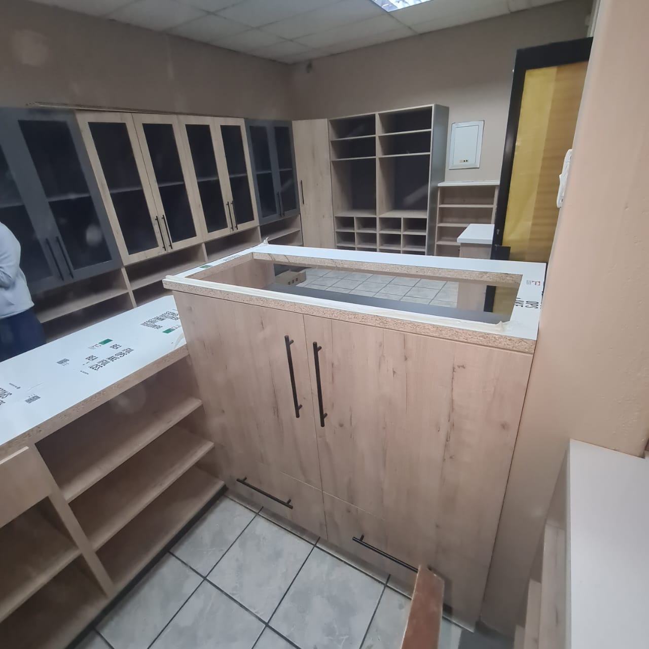 Scullery with wood-tone cupboards, Mbombela