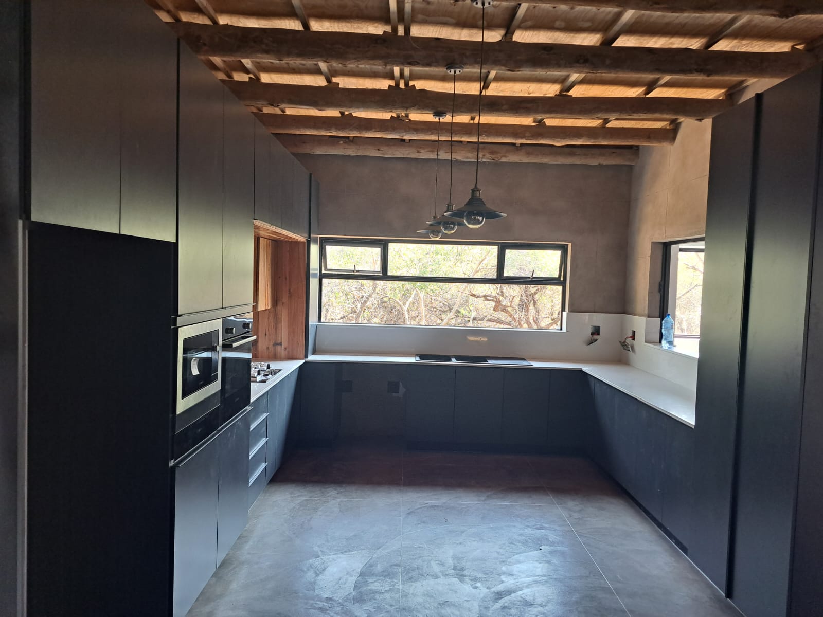 U-shape dark kitchen in bushveld lodge, Mpumalanga